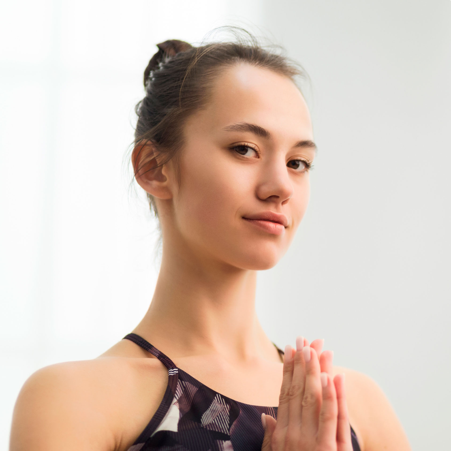 beautiful-woman-practising-yoga-holding-hands-in-n-VWMND38.jpg